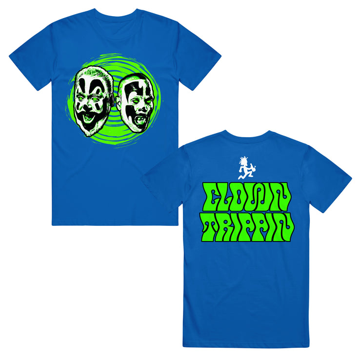 image of the front and back of a royal blue tee shirt on a white background. front is on the left and has the faces of shaggy and violent j with a green swirl behind them. the back is on the right and says clown trippin in groovy font