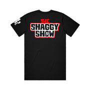 image of the back of a black tee shirt on a white background. tee has a print between the shoulders that says the shaggy show. white hatchetman logo on the sleeve