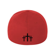 image of the back of a red flexfit hat on a white background. hat  has a bottom center print in black of three crosses
