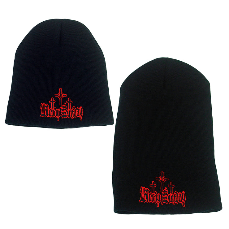 image of a small and a large black winter beanie on a white background. small is on the left and large is on the right. both have red and black embroidery across the bottom that has three crosses and says bloody sunday