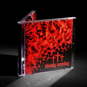 image of a jewel case  c d. cover has red bodies and three red crosses and says bloody sunday on the bottom right