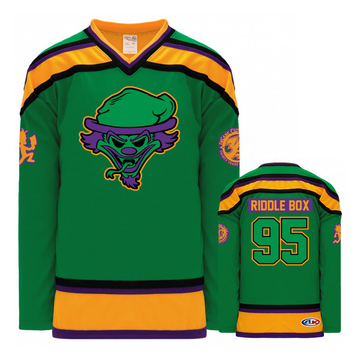 image of the front and back of a Green/Black/Gold - Hockey Jersey. the front is on the right and has a center patch of the riddlebox logo of a clown face with the tongue out. the back is on the right and has a patch across the shoulders that says riddle box. below that is the number 95