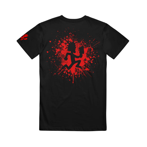 image of the back of a black tee shirt on a white background. tee has a red splatter print of the hatchetman logo