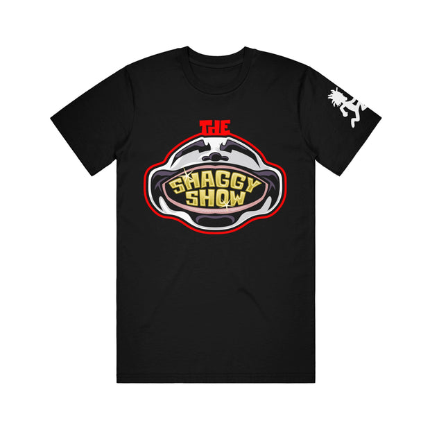 image of the front of a black tee shirt on a white background. tee has a shaggys face and mouth open. it says the shaggy show on the face. white hatchetman logo on the right sleeve