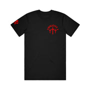 image of the front of a black tee shirt on a white background. tee has small red print on the right chest that says violet j above three crosses.